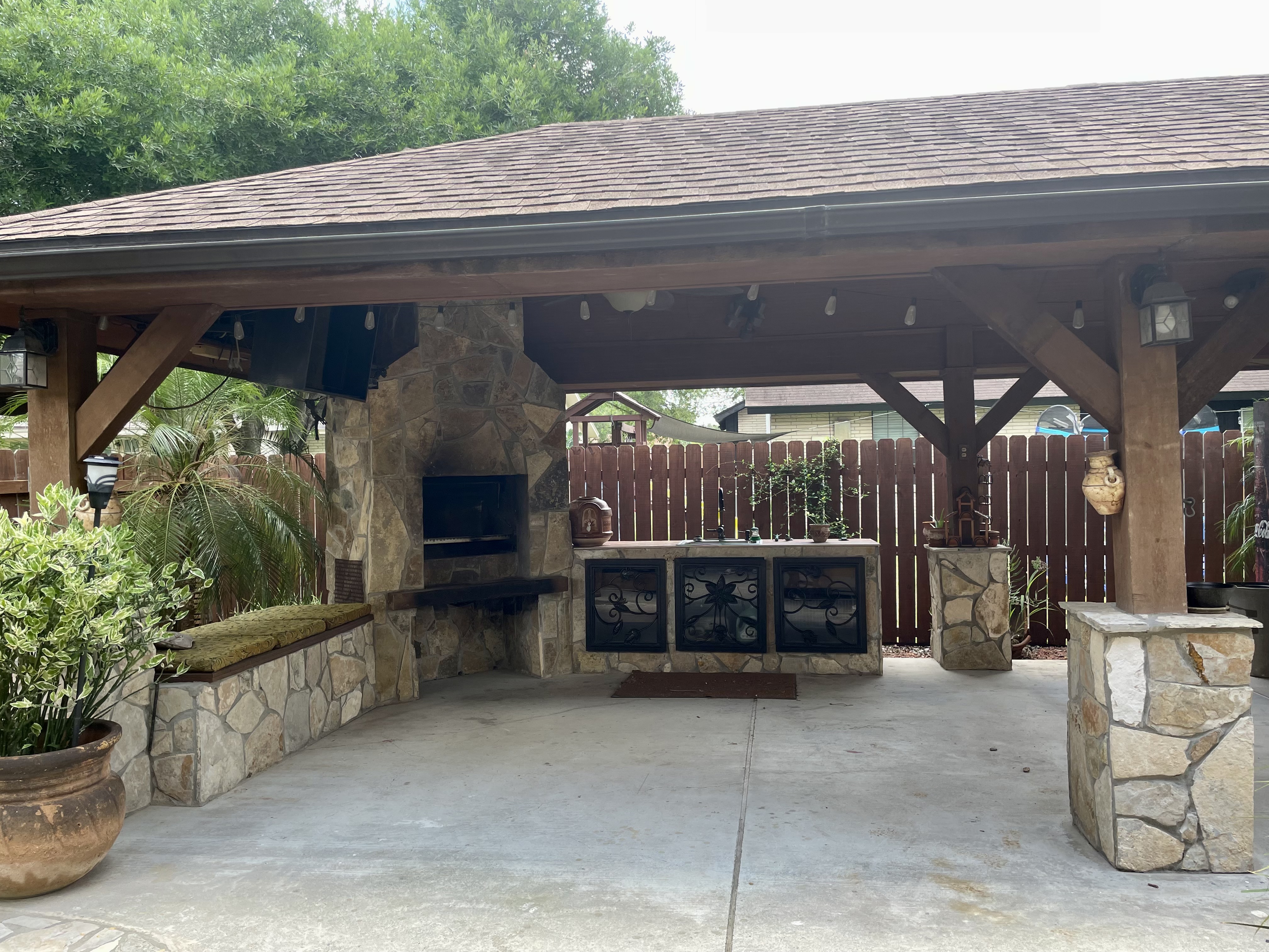 Completed outdoor kitchen build with counters and covered area